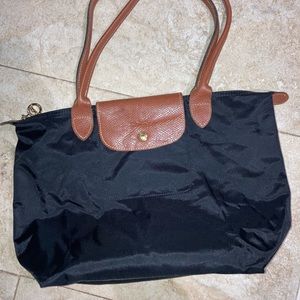 Black longchamp handbag.